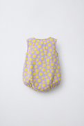 Baby wearing Anaario Lavender Yellow Polka Dot Button sleeveless romper, newborn to 24 months