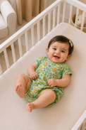 Baby wearing Anaario Multicolour Circle Print Bubble mint base romper, newborn to 24 months
