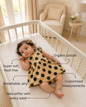 Baby wearing Anaario Mocha Dot Frill mocha base with black polka dots dress set, newborn to 24 months