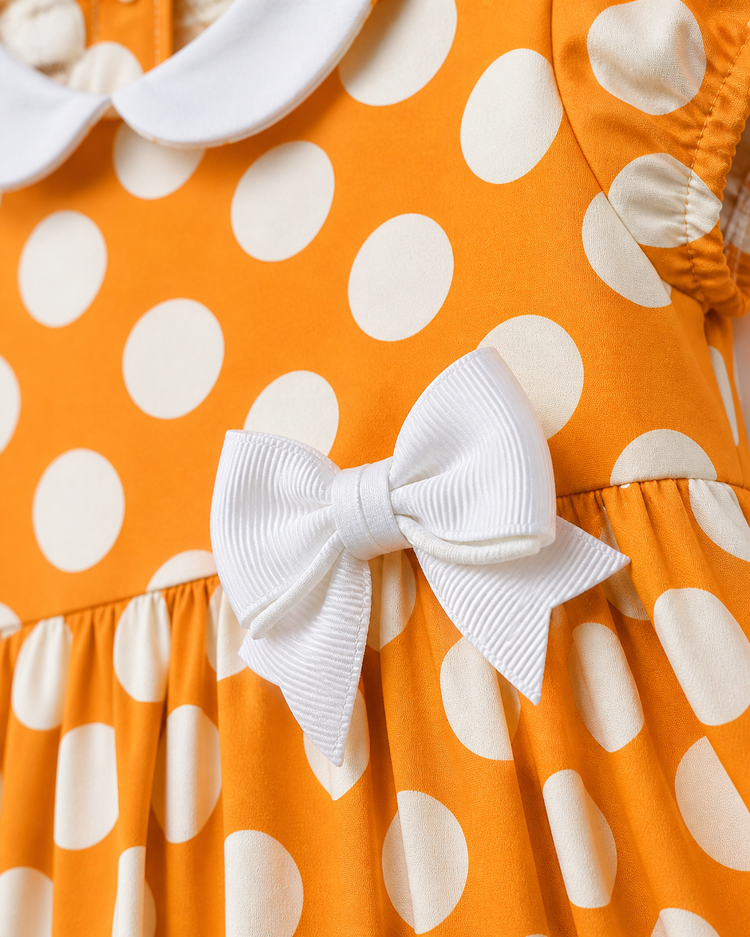 Baby wearing Anaario Orange Polka Bow orange with white polka dots dress set, newborn to 24 months