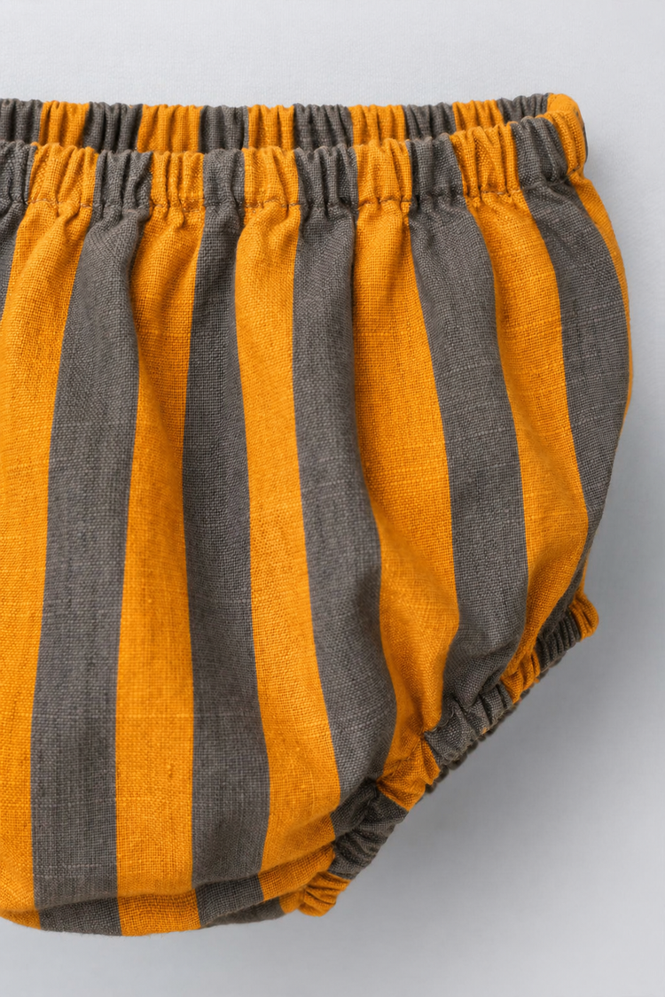 Baby wearing Anaario Orange Taupe Stripe Frill orange and taupe vertical stripes dress set, newborn to 24 months