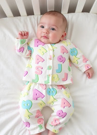 Baby wearing Anaario Pastel Multicolor Alphabets organic mulmul cotton Sakura set, newborn to 24 months