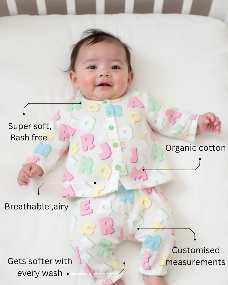 Baby wearing Anaario Pastel Multicolor Alphabets organic mulmul cotton Sakura set, newborn to 24 months