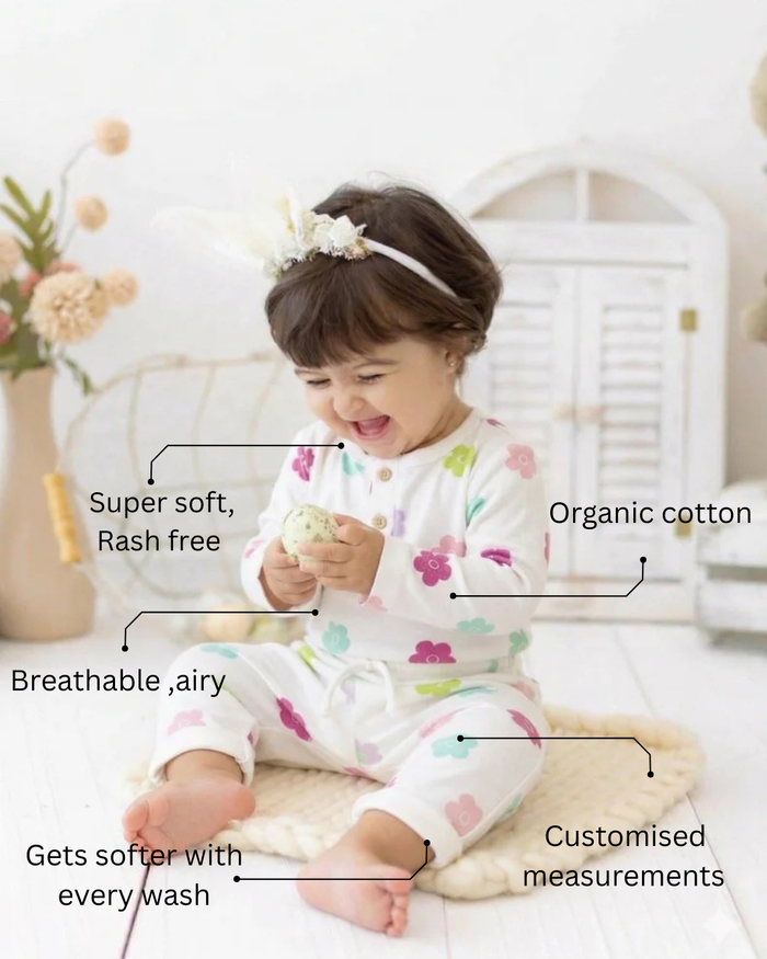 Baby wearing Anaario Pink Blossom organic mulmul cotton Gleeful Giggles set, newborn to 24 months