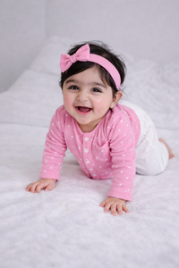 Baby wearing Anaario Pink and White Dots organic mulmul cotton Gleeful Giggles set, newborn to 24 months