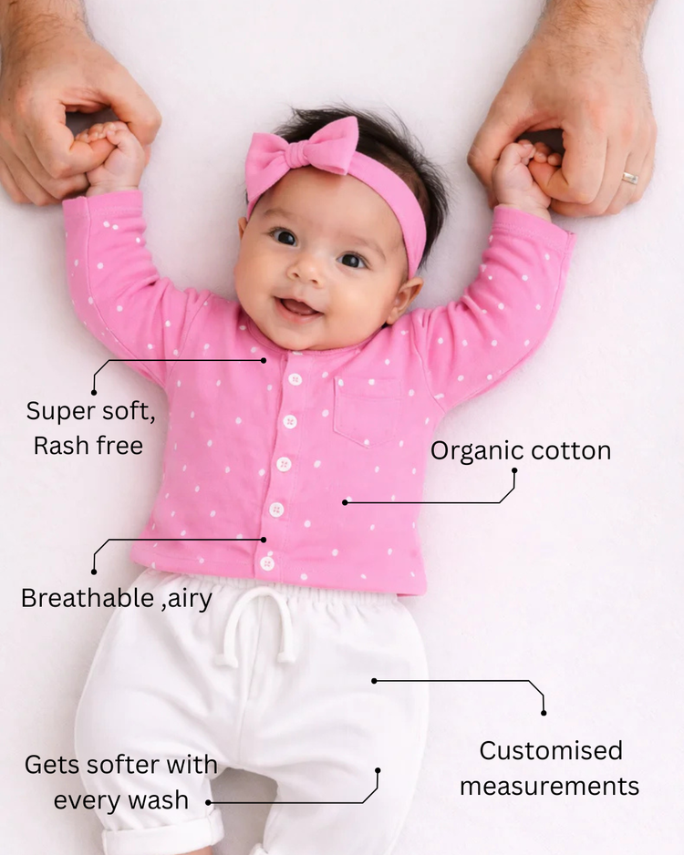 Baby wearing Anaario Pink and White Dots organic mulmul cotton Gleeful Giggles set, newborn to 24 months