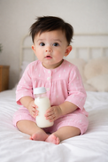 Baby wearing Anaario Pink and White Raindrops organic mulmul cotton Blossom Breeze set, newborn to 24 months