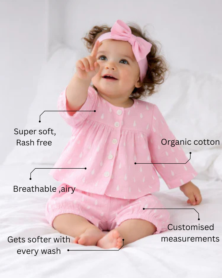 Baby wearing Anaario Pink and White Raindrops organic mulmul cotton Blossom Breeze set, newborn to 24 months