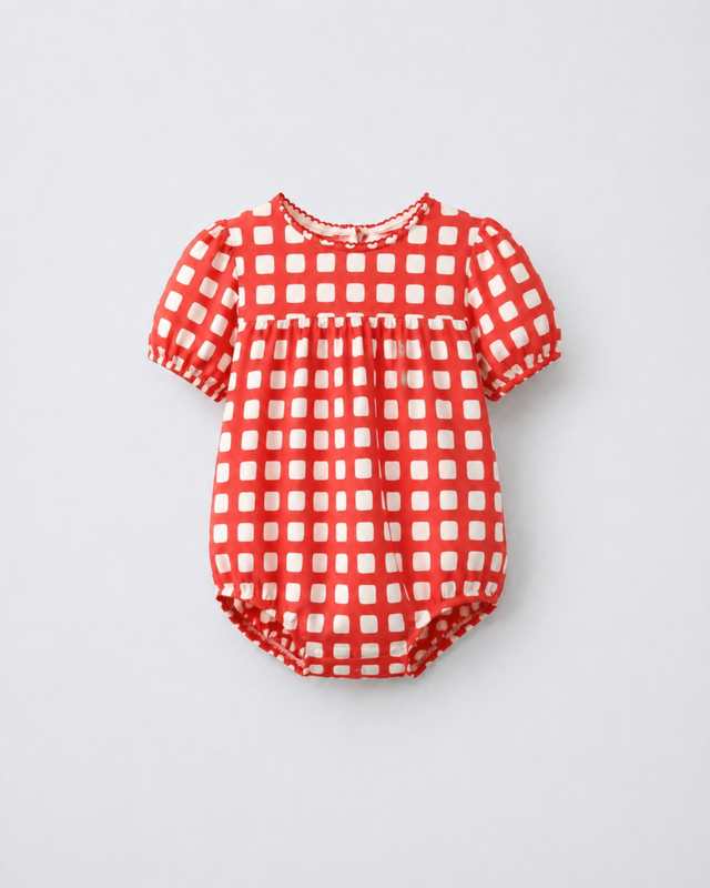 Baby wearing Anaario Cherry Check Bubble red and white gingham puff sleeve romper, newborn to 24 months
