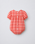 Baby wearing Anaario Cherry Check Bubble red and white gingham puff sleeve romper, newborn to 24 months