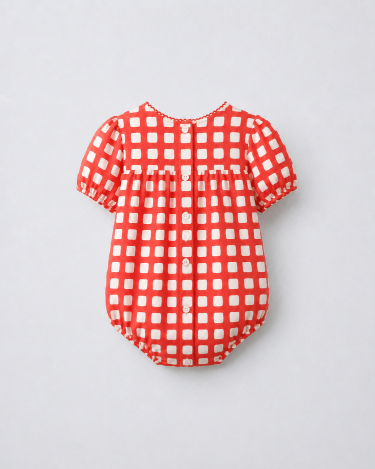 Baby wearing Anaario Cherry Check Bubble red and white gingham puff sleeve romper, newborn to 24 months