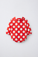 Baby wearing Anaario Crimson Dot Collared red with white polka dots romper with Peter Pan collar, newborn to 24 months