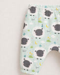 Baby wearing Anaario Sheep and Nightsky organic cotton pyjama set, newborn to 24 months