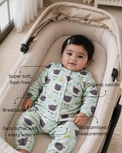 Baby wearing Anaario Sheep and Nightsky organic cotton pyjama set, newborn to 24 months