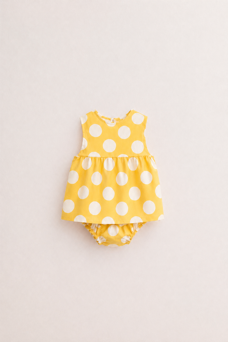 Baby wearing Anaario Yellow Polka Dot white with yellow polka dots dress set, newborn to 24 months