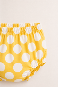 Baby wearing Anaario Yellow Polka Dot white with yellow polka dots dress set, newborn to 24 months