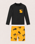 Boy wearing Anaario Black and Mustard Horse Swim Set