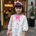 Girl wearing Anaario Bow Bliss Balloon Dress