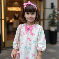 Girl wearing Anaario Bow Bliss Balloon Dress