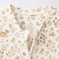 Bunny & Kitty Floral bamboo cotton baby sleepsuit — bamboo cotton onesie romper flatlay