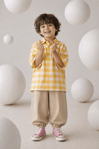 Boy wearing Anaario Butter Check Balloon Co-ord Set, yellow check shirt with matching balloon-style pant