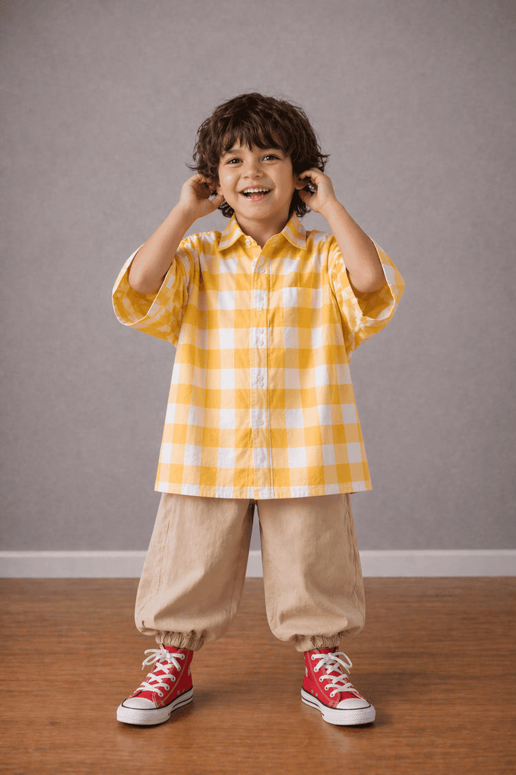Boy wearing Anaario Butter Check Balloon Co-ord Set, yellow check shirt with matching balloon-style pant