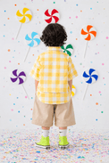 Boy wearing Anaario Butter Check Balloon Co-ord Set, yellow check shirt with matching balloon-style pant
