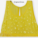 Girl wearing Anaario Buttercup Twirl Frock, yellow tulle twirl dress with heart appliqué