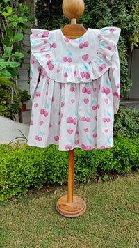Girl wearing Anaario Cherry Heart Ruffle Dress