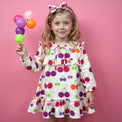 Girl wearing Anaario Cherry Jubilee Ruffle Dress