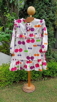 Girl wearing Anaario Cherry Jubilee Ruffle Dress