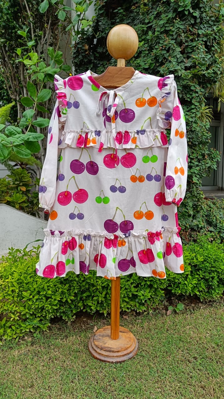 Girl wearing Anaario Cherry Jubilee Ruffle Dress