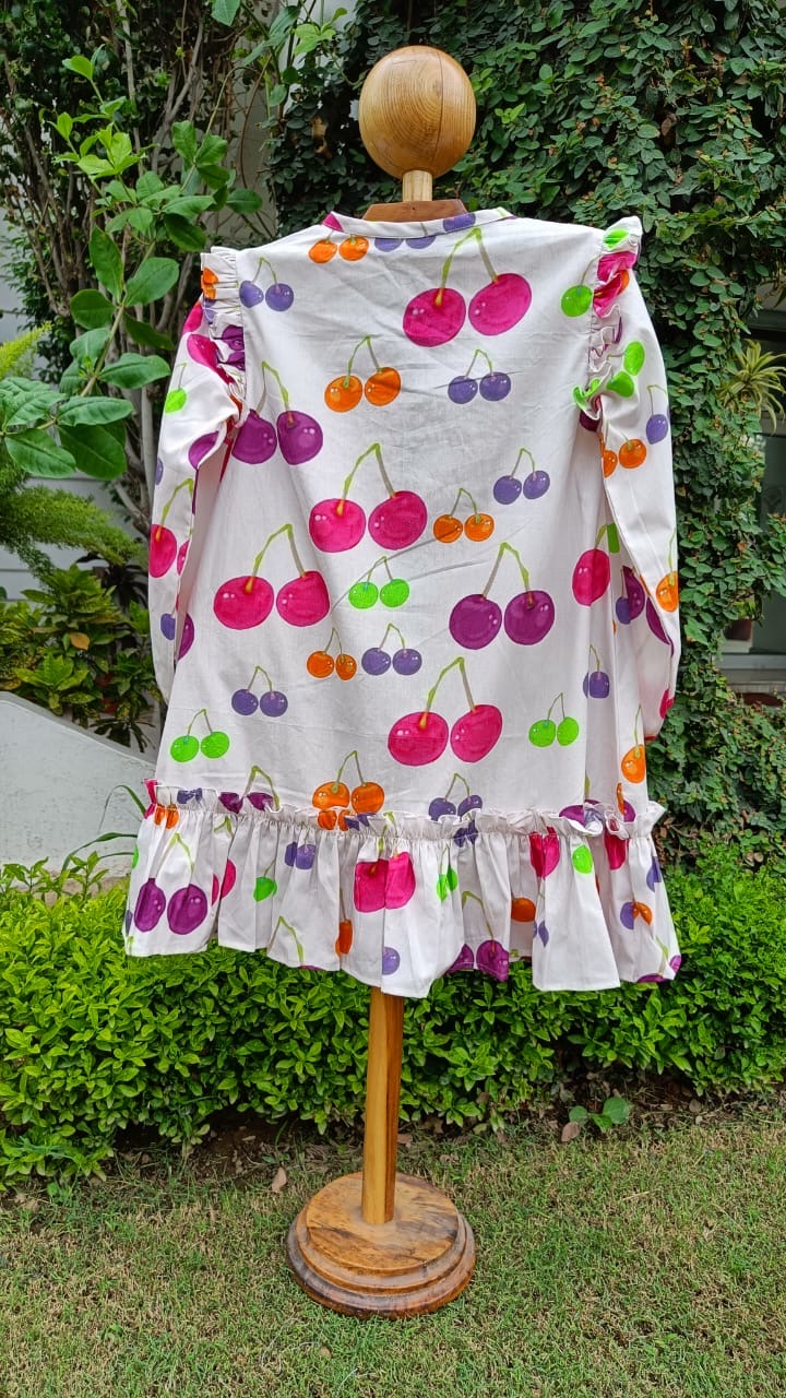 Girl wearing Anaario Cherry Jubilee Ruffle Dress