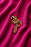 Flamingo embroidered motif, close-up detail