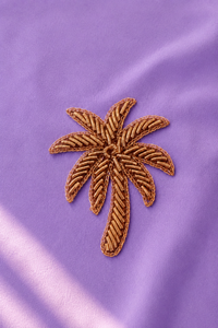 Palm-tree embroidered motif, close-up detail