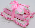 Snuggles and Cuddles Baby Blanket Gift Bundle (Ivory and Rose Poppy Raindrops) features