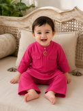Baby wearing Anaario Fuchsia Moon-Star Baby Kurta Set, fuchsia kurta with moon-and-star motif, newborn to 24 months