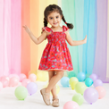 Girl wearing Anaario Coral Garden Smocked Dress