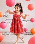 Girl wearing Anaario Coral Garden Smocked Dress