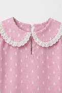 Girl wearing Anaario Pink and White Raindrops Night Suit