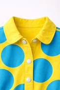 Girl wearing Anaario Canary Teal Pop Romper