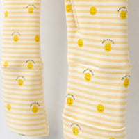 Happy Sunshine bamboo cotton baby sleepsuit — bamboo cotton onesie romper flatlay