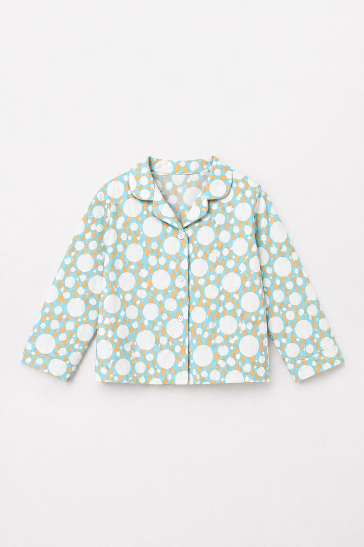 Boy wearing Anaario Ivory and Tangerine Poppy Raindrops Night Suit