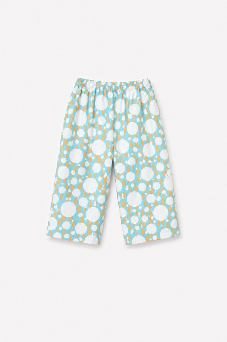 Boy wearing Anaario Ivory and Tangerine Poppy Raindrops Night Suit