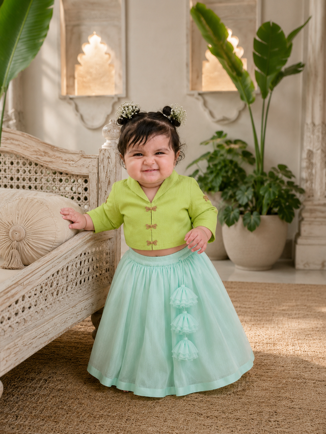 Lime green jacket-style top with gold dragonfly buttons and mint green flared lehenga skirt for baby girl