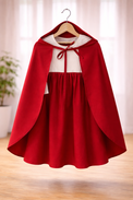 Girl wearing Anaario Little Red Riding Hood Dress, red hooded cape over white and red dress