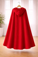 Girl wearing Anaario Little Red Riding Hood Dress, red hooded cape over white and red dress