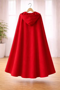 Girl wearing Anaario Little Red Riding Hood Dress, red hooded cape over white and red dress