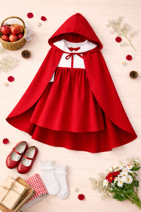 Girl wearing Anaario Little Red Riding Hood Dress, red hooded cape over white and red dress