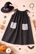 Girl wearing Anaario Midnight Spell Witch Gown, black gown with grid-print pockets and witch hat